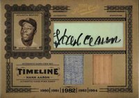 2005 Playoff Prime Cuts Timeline #T-13 Hank Aaron Autograph-Material Combo Baseball Card